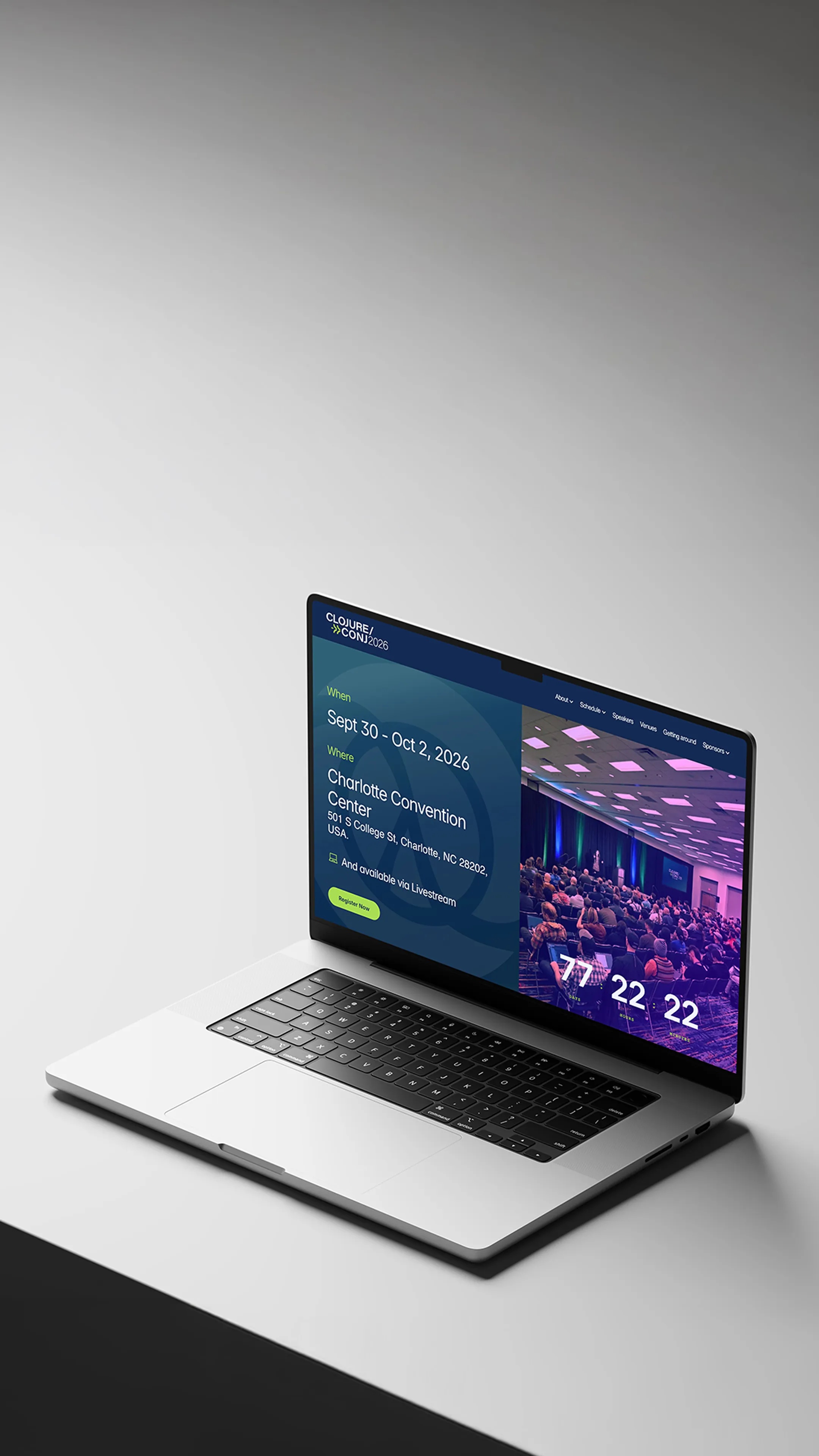 Sitio web de Clojure Conj 2026 mostrado en una laptop